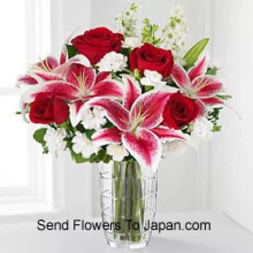Red Roses, Pink Lilies With Assorted White Flowers In A Glass Vase