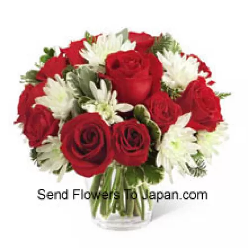 This Bouquet is a charming display of holiday beauty and winter warmth. Rich red roses and spray roses pop against white chrysanthemums, assorted Chinese New Year greens and eucalyptus, arranged in a round clear glass vase to create a gift that will spread the goodwill of the season to your special recipient. (Please Note That We Reserve The Right To Substitute Any Product With A Suitable Product Of Equal Value In Case Of Non-Availability Of A Certain Product)