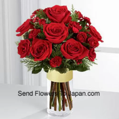 Send them the warmth and heartfelt sentiments expressed throughout the holiday season. Rich red roses and spray roses are offset by burgundy mini carnations, variegated holly stems and assorted holiday greens, beautifully arranged in a clear glass gold banded vase to bring your special recipient a merry moment they will treasure throughout the Chinese New Year season. (Please Note That We Reserve The Right To Substitute Any Product With A Suitable Product Of Equal Value In Case Of Non-Availability Of A Certain Product)